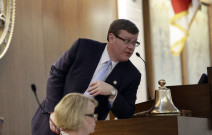 Speaker Tim Moore bent over like he's expecting his boy friend to show up (AP Photo/Gerry Broome)